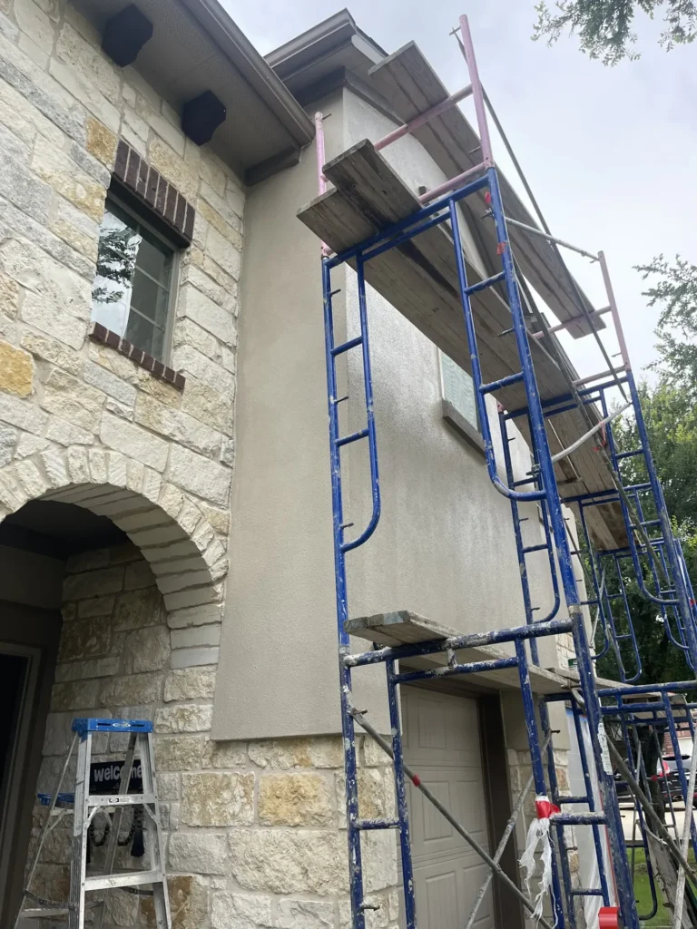 Scaffolding set up for stucco and stone repair on a Texas home